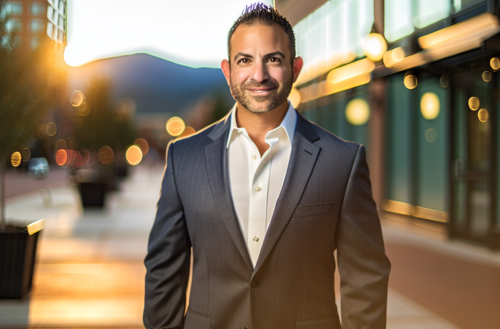 Entrepreneur in downtown Western Colorado with a mountain backdrop representing local business leadership