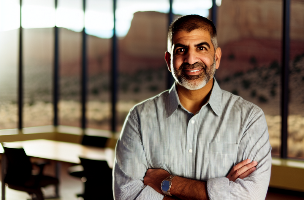 Local business leader in Fruita and Grand Junction reviewing online reputation metrics on a laptop in a modern office