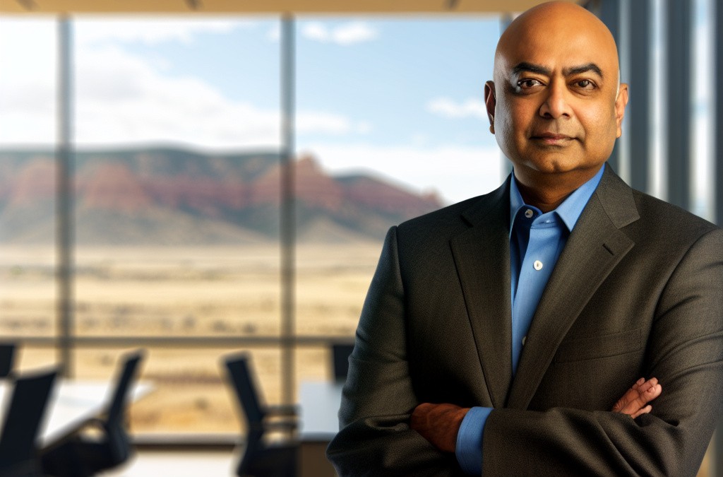 Businessman in a modern office setting with a Colorado landscape view, representing reputation and local business leadership.